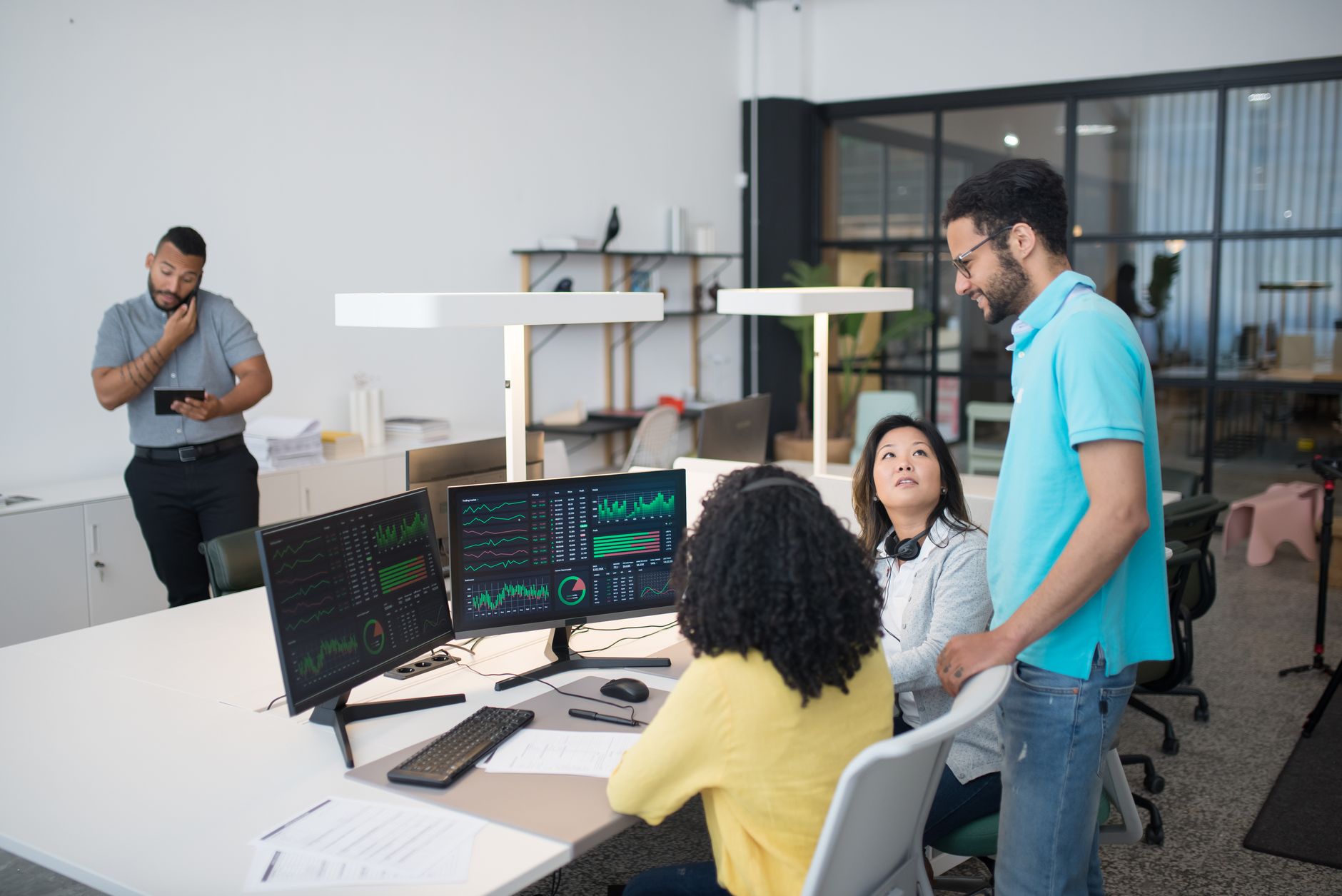 Office team reviewing simple per-user pricing together